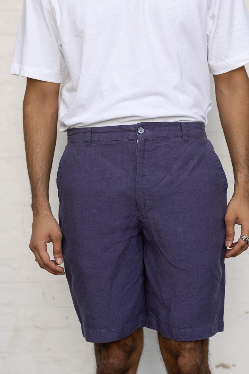 Person wearing Blueberry Shorts and a white shirt against a plain background