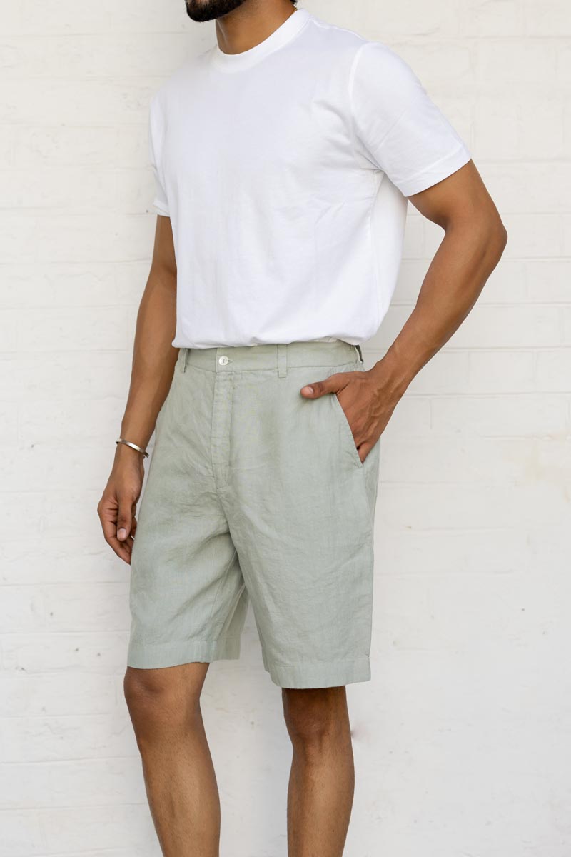 Person wearingMint Green Shorts and a white t-shirt against a plain background