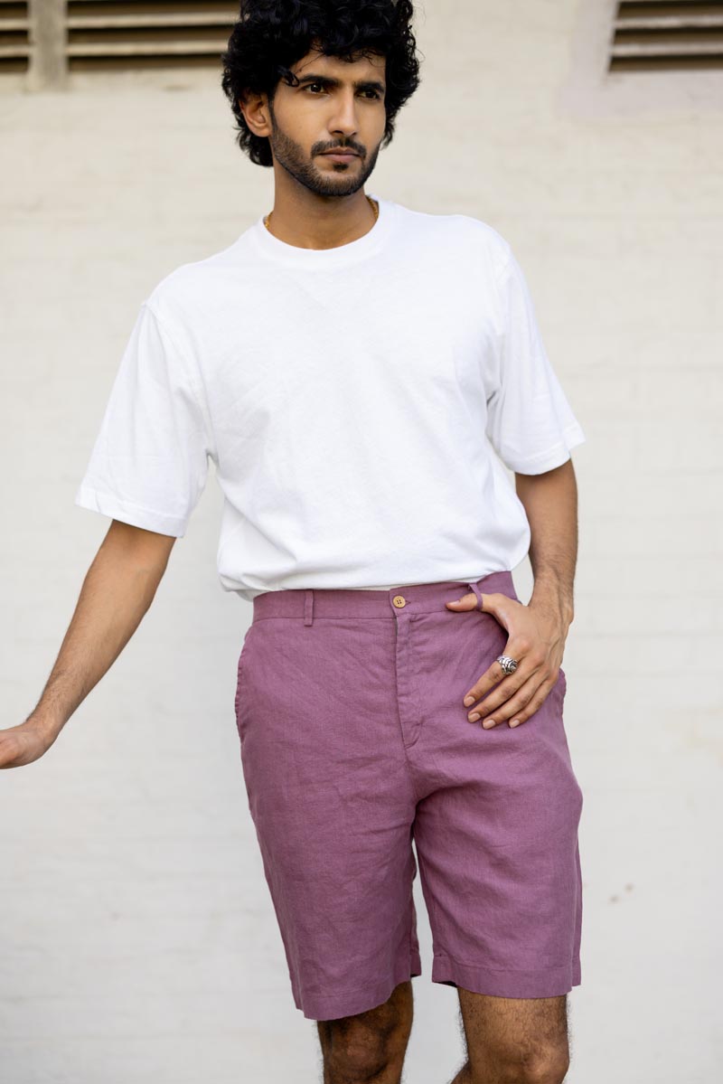 Man wearing a white t-shirt and Twilight Purple Shorts against a plain background