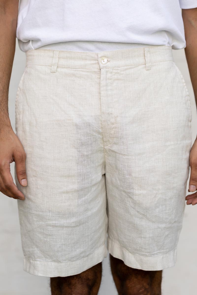 Person wearing lIvory Check Shorts on a plain background