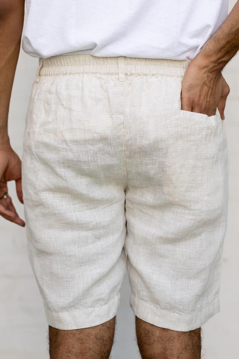 Person wearing Ivory Check Shorts with a plain background