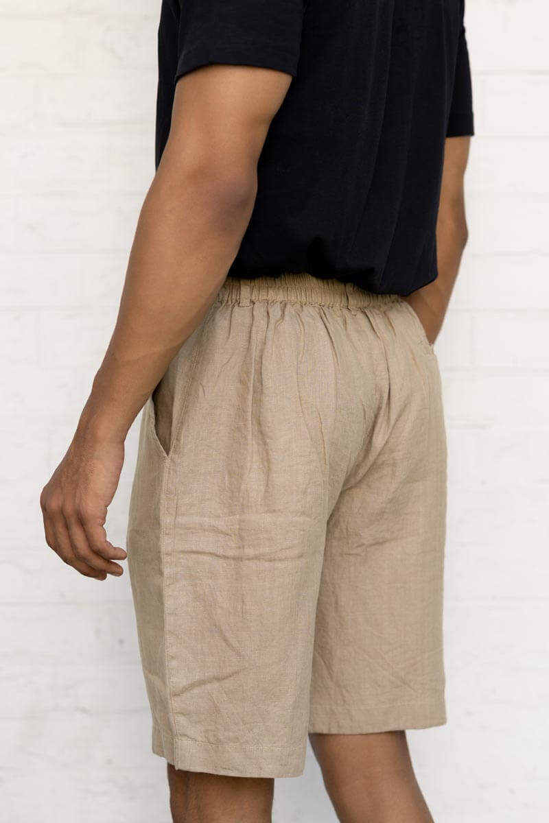 Desert Sand Shorts worn by a person against a white background