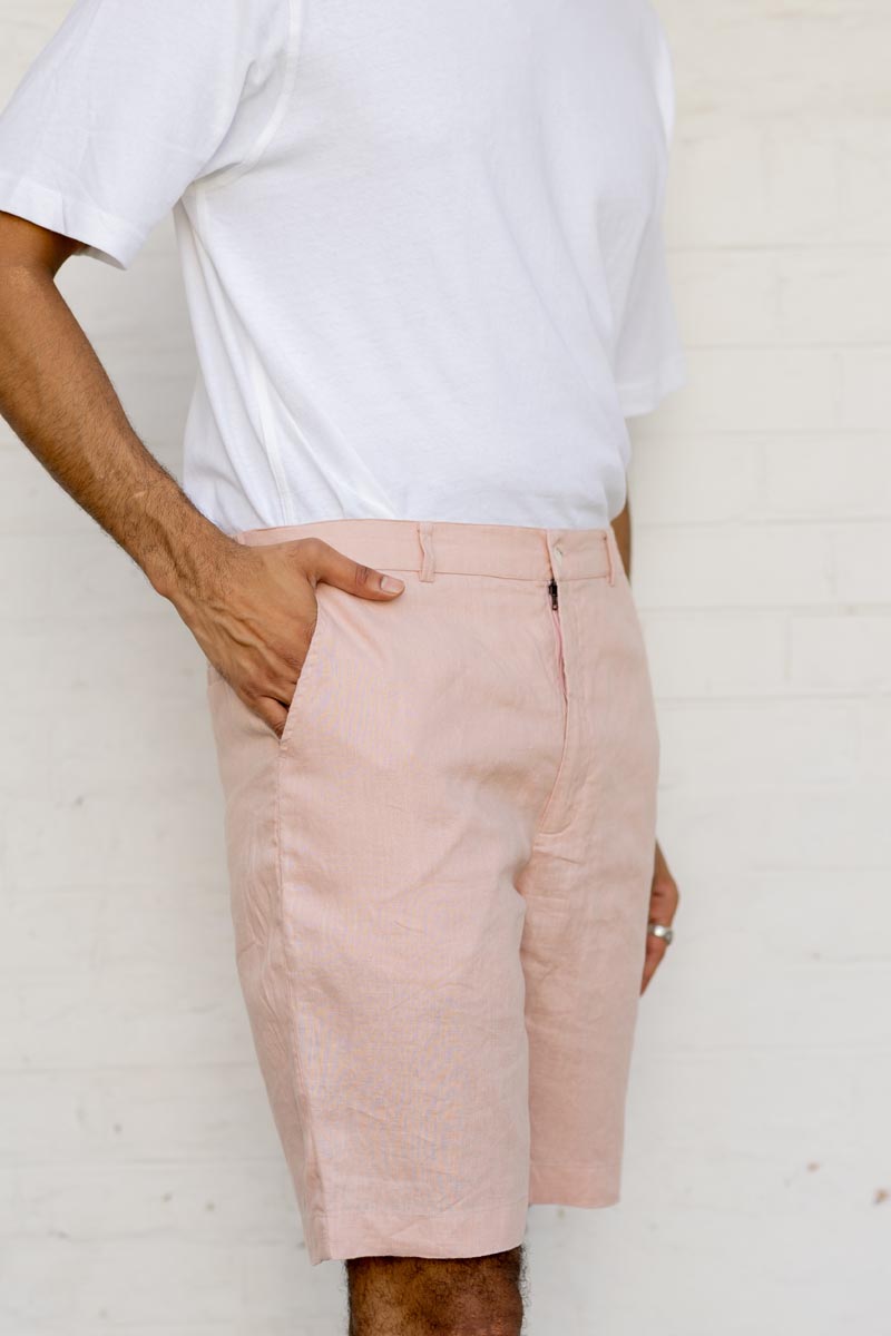 Person wearing Flamingo Shorts and a white shirt against a plain background