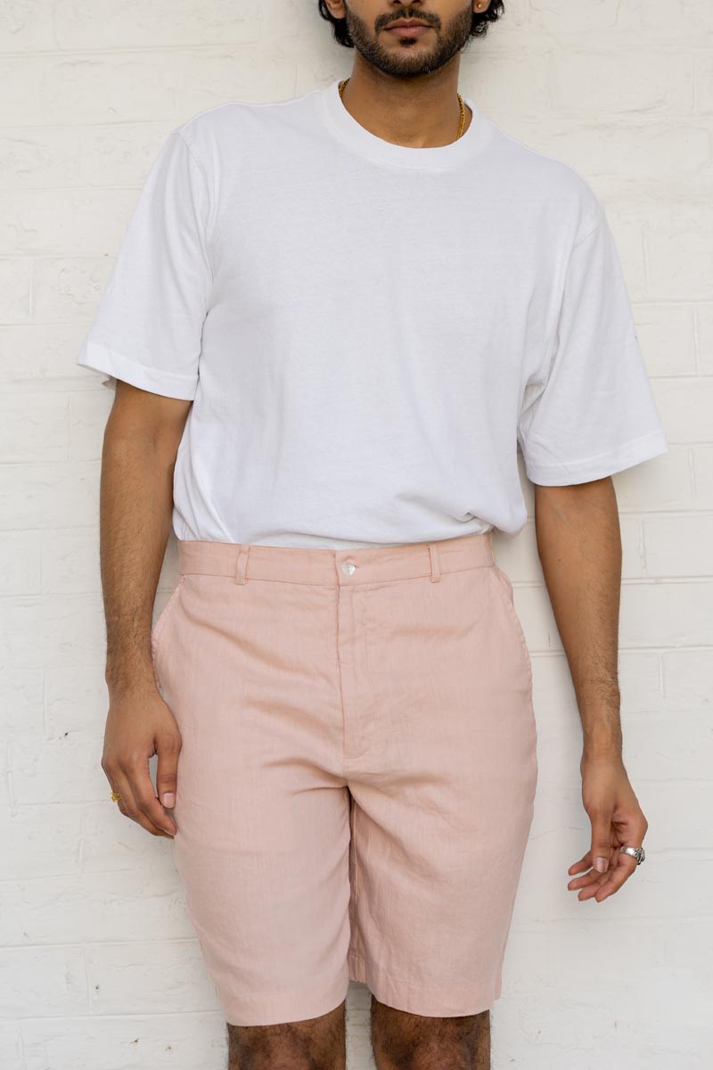 Person wearing a light gray t-shirt and Flamingo Shorts against a white background