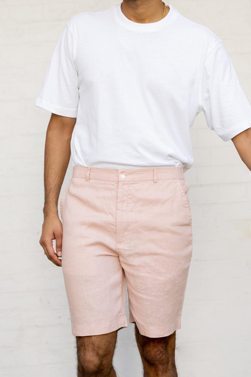 Person wearing a white t-shirt and Flamingo Shorts against a plain background