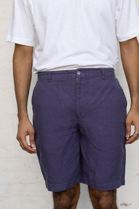Person wearing Blueberry Shorts and a white shirt against a plain background