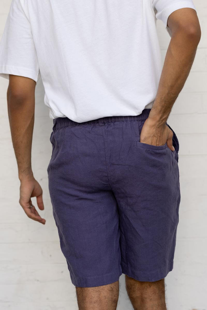 Person wearing Blueberry Shorts and a white shirt against a white background
