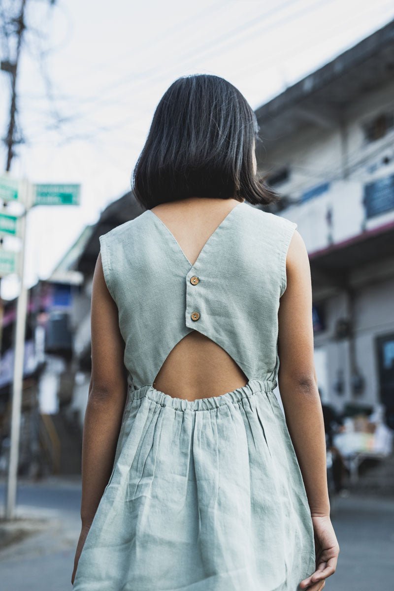 Two buttoned back opening frock